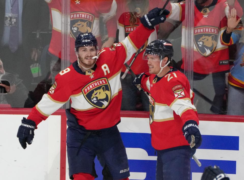 Florida Panthers center Nick Cousins (21) celebrates the goal by left wing Matthew Tkachuk (19) in the first period against the Boston Bruins.