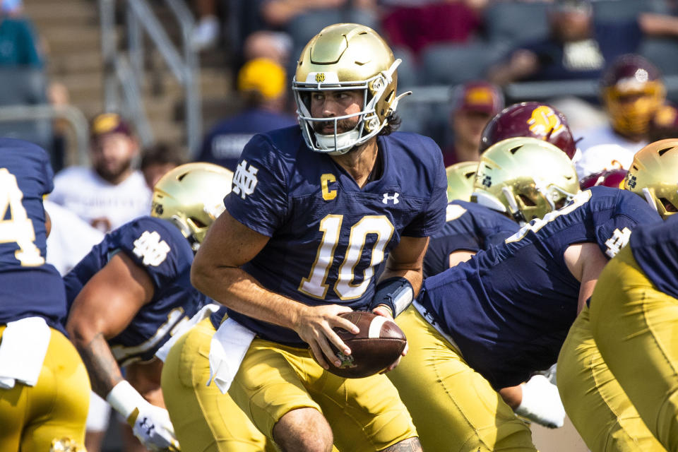 Notre Dame's Sam Hartman (10) takes a snap during the first half of an NCAA college football game against Central Michigan on Saturday, Sept. 16, 2023, in South Bend, Ind. (AP Photo/Michael Caterina)