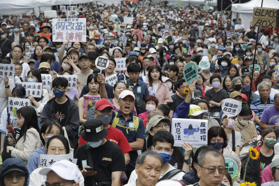 Supporters of the ruling Democratic Progressive Party (DPP) gather in front of the legislative building in Taipei, Taiwan, Tuesday, May 28, 2024. (AP Photo/Chiang Ying-ying)