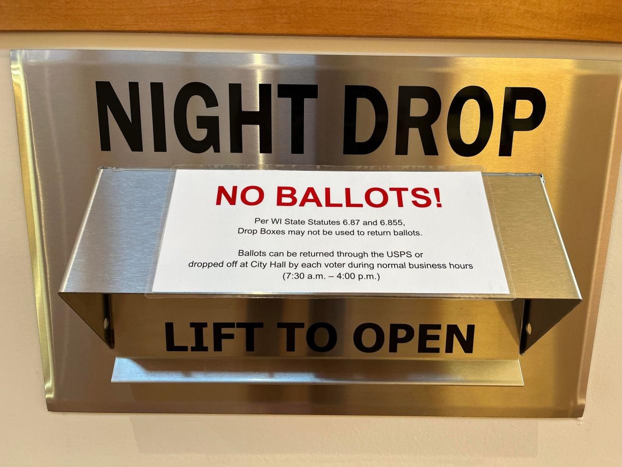 City of Oak Creek clerks put up signage on city drop boxes to inform residents that they are not allowed to place their ballots in the drop boxes outside city hall.