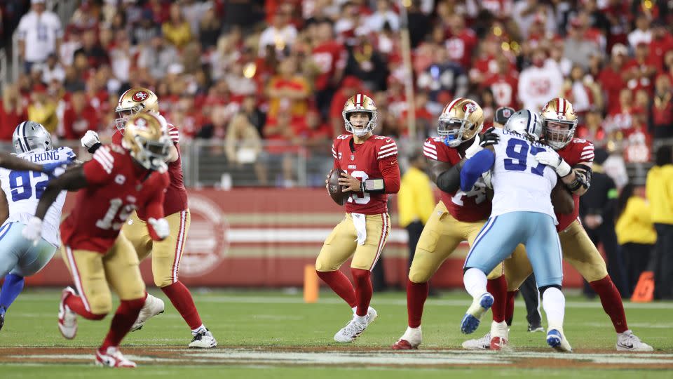 Purdy looks to pass during the third quarter against the Cowboys. - Ezra Shaw/Getty Images