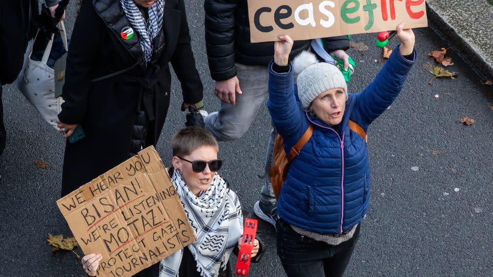 A protester holds a sign in support of Palestinian journalists in Gaza during a pro-Palestinian march in London on December 9, 2023. - Mark Kerrison/In Pictures/Getty Images