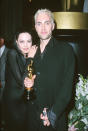 In 2000, Jolie went goth in a black Donatella Versace dress and, after winning the Best Supporting Actress statuette for Girl, Interrupted, sparked some controversy by kissing her brother James in the press room.