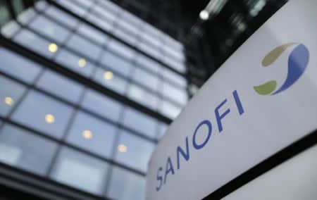 A logo is seen in front of the entrance at the headquarters French drugmaker Sanofi in Paris October 30, 2014. REUTERS/Christian Hartmann