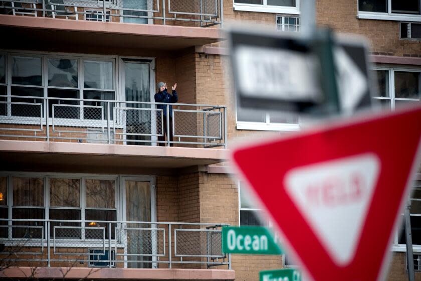 A resident applauds healthcare workers of Coney Island Hospital in 2020