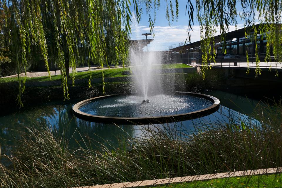 The east fountain at Classen Curve, shown in this photo, adjoins the Meadowbrook Acres neighborhood and was built in response to residents' concerns about the density and flooding impact of the development. Washington Prime, which bought the shopping center in 2014, plans to tear out the fountain and replace it with a new retail building. A west fountain also is to be torn down to build more parking.