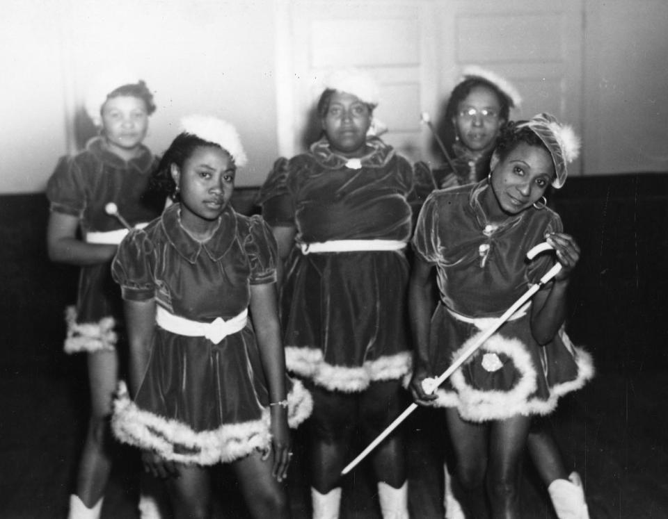 This 1942 photo provided by the Louisiana State Museum shows Gold Digger Baby Dolls, one of the neighborhood groups that adopted the "baby doll" costumes. The costumes first became part of New Orleans' Mardi Gras in 1912 with a group of black prostitutes, but spread within decades into the city's respectable African-American neighborhoods. The tradition is enjoying a modern resurgence. (AP Photo/State Library of Louisiana, Collection of the U.S. Works Progress Administration of Louisiana)
