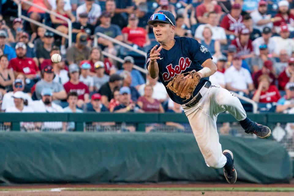 Jun 20, 2022; Omaha, NE, USA; Ole Miss Rebels third baseman Garrett Wood (40) passes to first base against the Arkansas Razorbacks during the fifth inning at Charles Schwab Field. Mandatory Credit: Dylan Widger-USA TODAY Sports