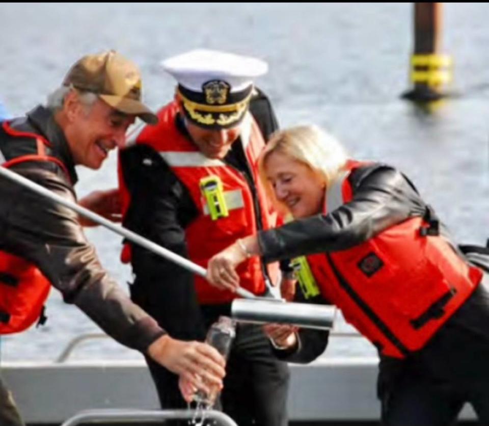 From left, former Idaho Gov. Dirk Kempthorne, then-Cmdr. Nicholas Meyers and ship sponsor Terry Stackley collect water from an Idaho lake to be used during the March 16 christening ceremony of the USS Idaho. Water from four Idaho lakes will be the first water to touch the submarine.