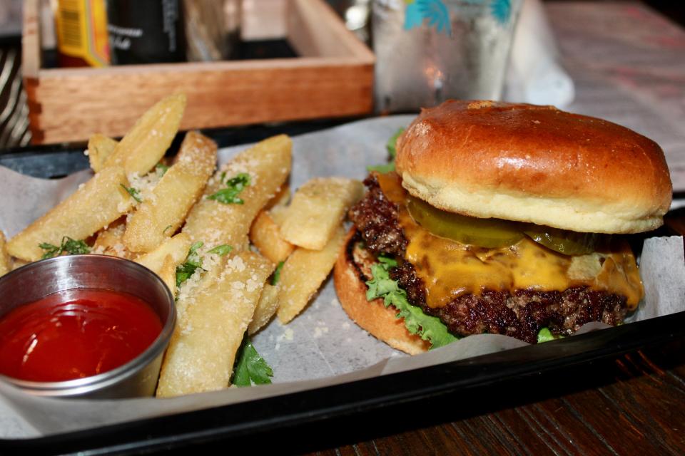 Locale Neighborhood Bar & Grille in Lake Park offers a smash burger with parmesan fries among other American favorites.