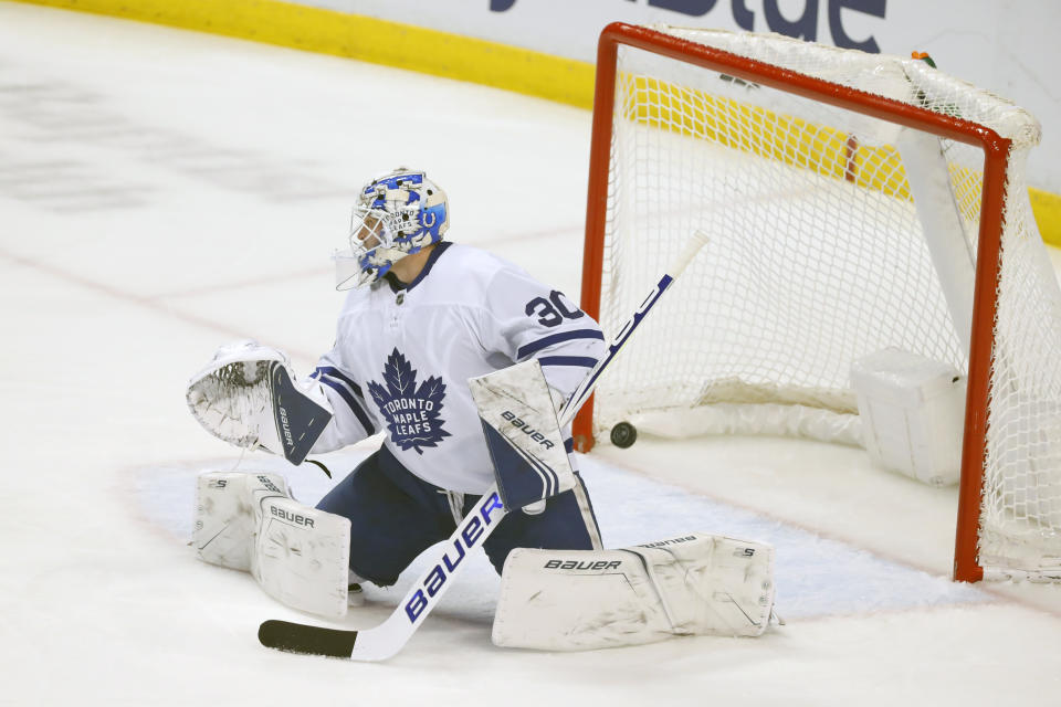 A shot by Florida Panthers center Vincent Trocheck gets past Toronto Maple Leafs goaltender Michael Hutchinson (30) for a goal during the second period of an NHL hockey game, Sunday, Jan. 12, 2020, in Sunrise, Fla. (AP Photo/Wilfredo Lee)