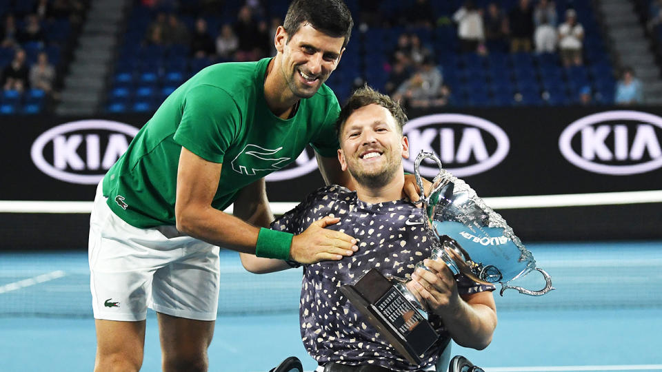 Dylan Alcott, pictured here celebrating his Australian Open triumph with Novak Djokovic.