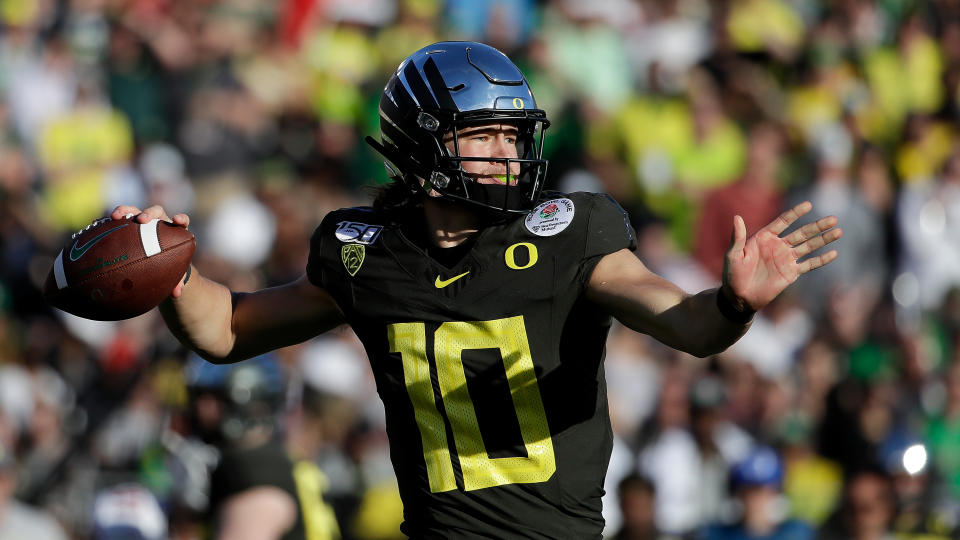 Oregon quarterback Justin Herbert will be selected early in the NFL draft. (AP Photo/Marcio Jose Sanchez)