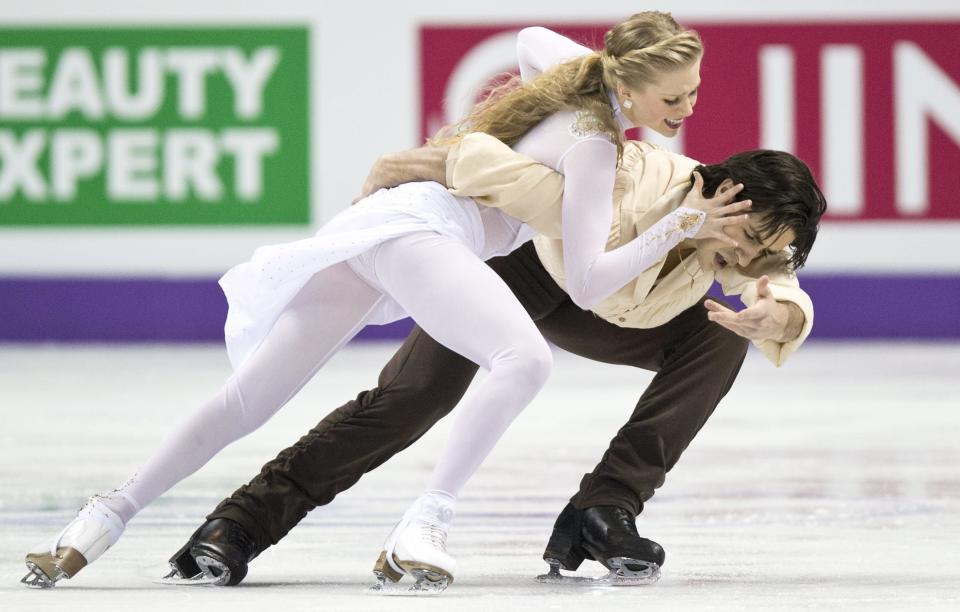 Kaitlyn Weaver and Andrew Poje of Canada perform in the Ice Dance free program at the ISU World Figure Skating Championships in London, Ontario on Saturday, March 16, 2013. (AP Photo/The Canadian Press, Paul Chiasson)