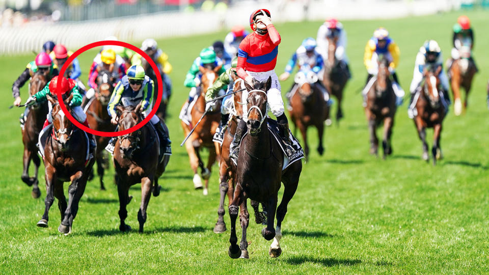 Damien Oliver, pictured here in the yellow cap riding Delphi in the Melbourne Cup. 