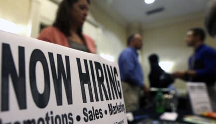 Economy (In this Thursday, Oct. 25, 2012, photo, a sign attracts job-seekers during a job fair at the Marriott Hotel in Colonie,