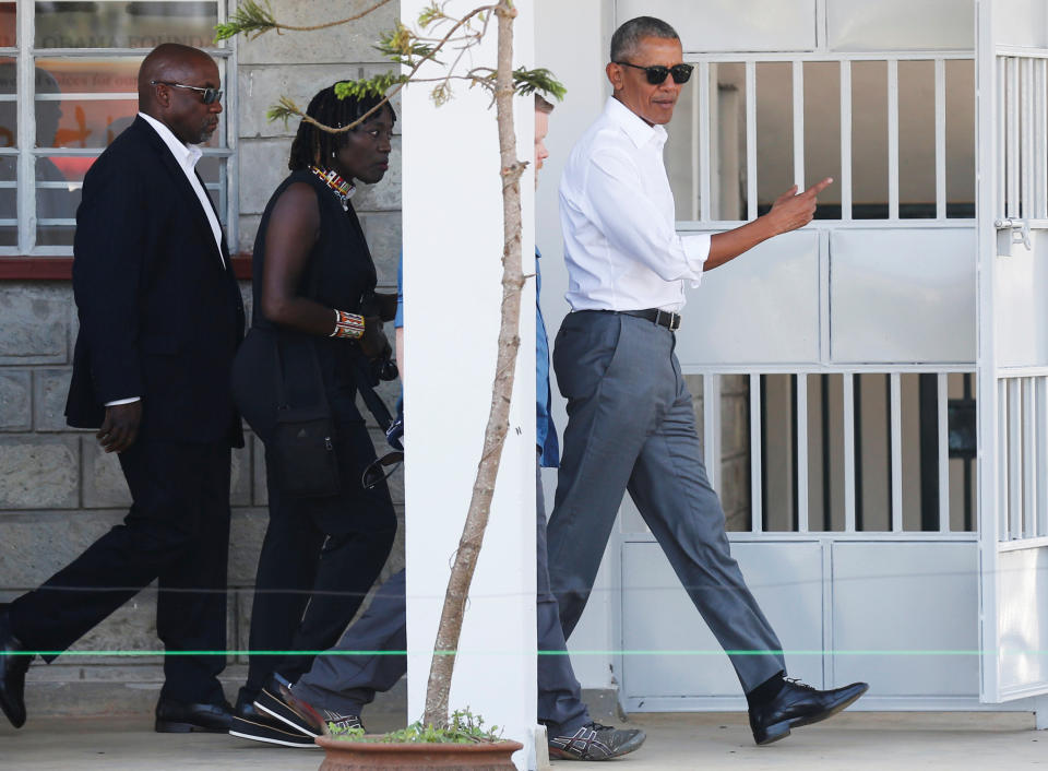 <p>Former U.S. President Barack Obama listens to Auma Obama as he tours the Sauti Kuu resource centre near his ancestral home in Nyangoma Kogelo village in Siaya county, western Kenya July 16, 2018. (Photo: Thomas Mukoya/Reuters) </p>