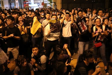 Protesters attend a "Stand With Hong Kong, Power to the People Rally" at the Chater Garden, in Hong Kong