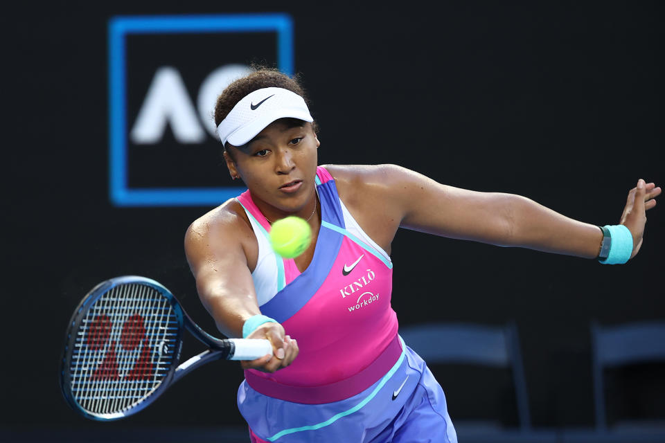 MELBOURNE, AUSTRALIA - JANUARY 21: Naomi Osaka of Japan plays a forehand in her third round singles match against Amanda Anisimova of United States during day five of the 2022 Australian Open at Melbourne Park on January 21, 2022 in Melbourne, Australia. (Photo by Mark Metcalfe/Getty Images)