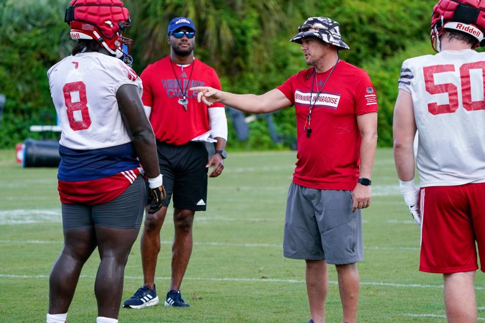 Florida Atlantic head coach Tom Herman works with the defense during practice at the Schmidt Family Complex, Thursday, August 3, 2023 in Boca Raton.