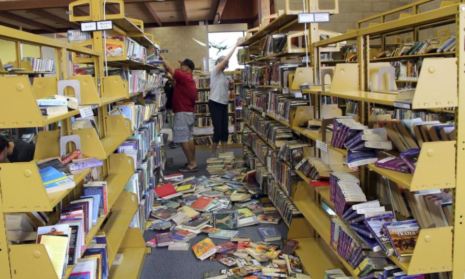 Volunteers assist with cleanup at the Ridgecrest, California, branch of the Kern County Library following the California earthquake.