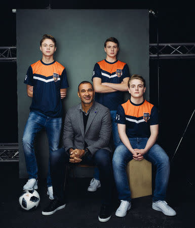 Former Dutch soccer player Ruud Gullit poses with professional eSports players of Team Gullit academy, Dani Visser, Julian van den Berg and Floris Jorna in Amsterdam, Netherlands, December 15, 2017. Team Gullit/Handout via REUTERS