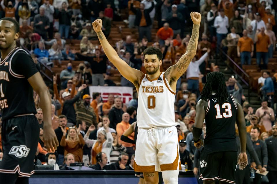 Texas forward Timmy Allen celebrates the Longhorns' 56-51 win against OSU on Saturday in Austin.