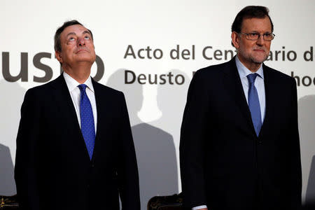 European Central Bank (ECB) President Mario Draghi (L) and Spanish Prime Minister Mariano Rajoy attend a meeting of the Deusto Business School in Madrid, Spain, November 30, 2016. REUTERS/Juan Medina