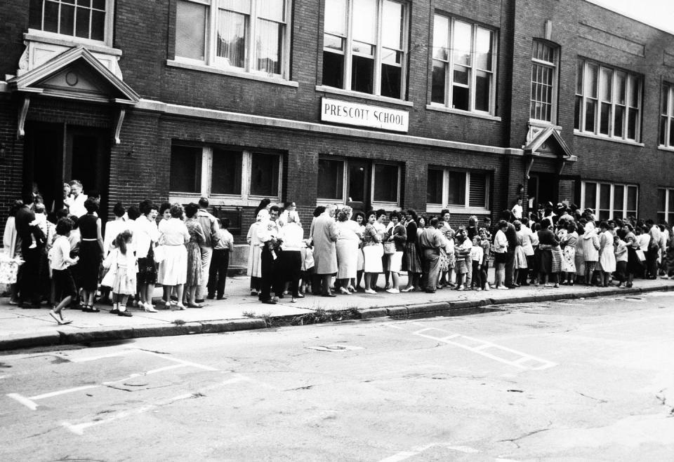 <span class="caption">Children and parents lined up for polio vaccines outside a Syracuse, New York school in 1961.</span> <span class="attribution"><a class="link " href="https://newsroom.ap.org/detail/LinedUpForPolioVaccine1961/4da7b3b42ecd4a68a089a5985f951f32/photo?Query=school%20vaccine&mediaType=photo&sortBy=arrivaldatetime:asc&dateRange=Anytime&totalCount=1077&currentItemNo=9" rel="nofollow noopener" target="_blank" data-ylk="slk:AP Photo;elm:context_link;itc:0;sec:content-canvas">AP Photo</a></span>