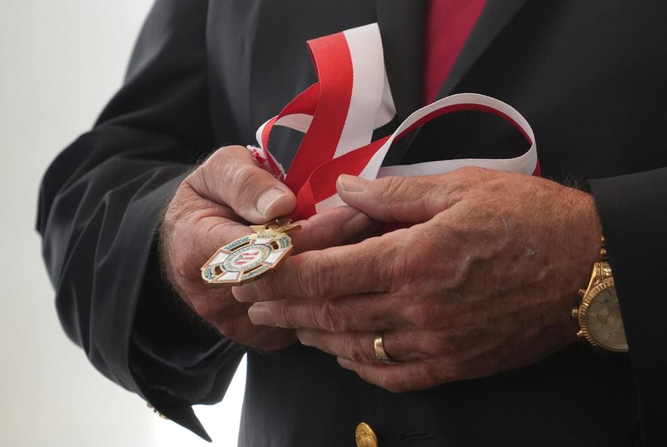 Ohio Military Hall of Fame Director Robert J. Labadie accepts the award for U.S. Navy Fireman Apprentice Lawrence Salisbury during the 2022 induction ceremony for the Ohio Military Hall of Fame for Valor on Friday at the Ohio Statehouse.