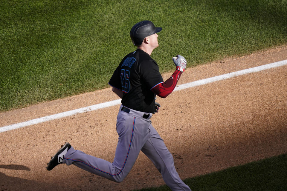 Miami Marlins' Garrett Cooper celebrates as he rounds the bases after hitting a solo home run during the seventh inning in Game 2 of a National League wild-card baseball series against the Chicago Cubs Friday, Oct. 2, 2020, in Chicago. (AP Photo/Nam Y. Huh)