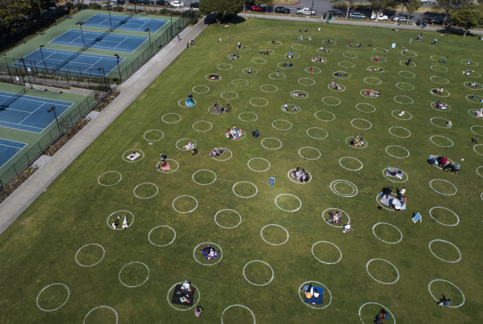 SAN FRANCISCO, CA - MAY 21: People utilize social-distancing circles at Dolores Park in San Francisco, Calif., on Thursday, May 21, 2020. The Parks and Recreation Department painted the circles in the northernmost area of the park, but other areas have not been painted. (Jane Tyska/Digital First Media/East Bay Times via Getty Images)