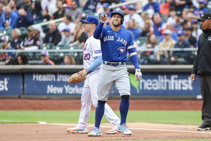 Toronto Blue Jays right fielder George Springer (4) points to the dugout after hitting a single in the first inning against the New York Mets at Citi Field.