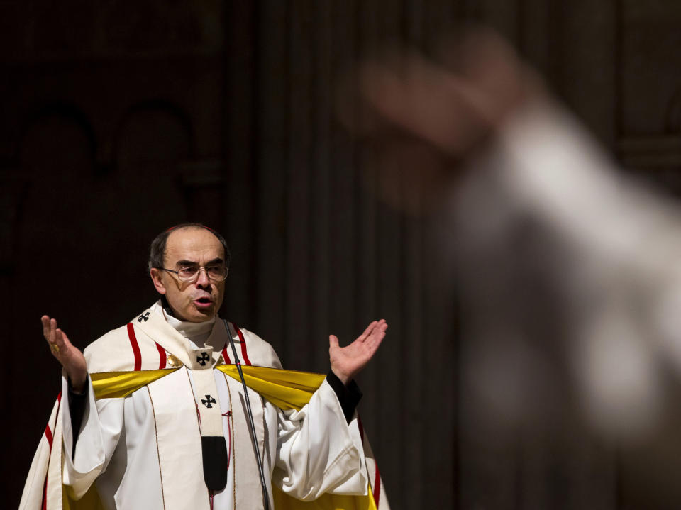 FILE - In this April 3, 2016 file photo, French Cardinal Philippe Barbarin, Archbishop of Lyon, leads a mass for migrants in the Saint-Jean Cathedral, in Lyon, central France. The Roman Catholic Church faces another public reckoning when a French cardinal goes on trial Monday, Jan. 7, 2019 for his alleged failure to report a pedophile priest who confessed to preying on Boy Scouts and whose victims want to hold one of France’s highest church figures accountable. (AP Photo/Laurent Cipriani, File)