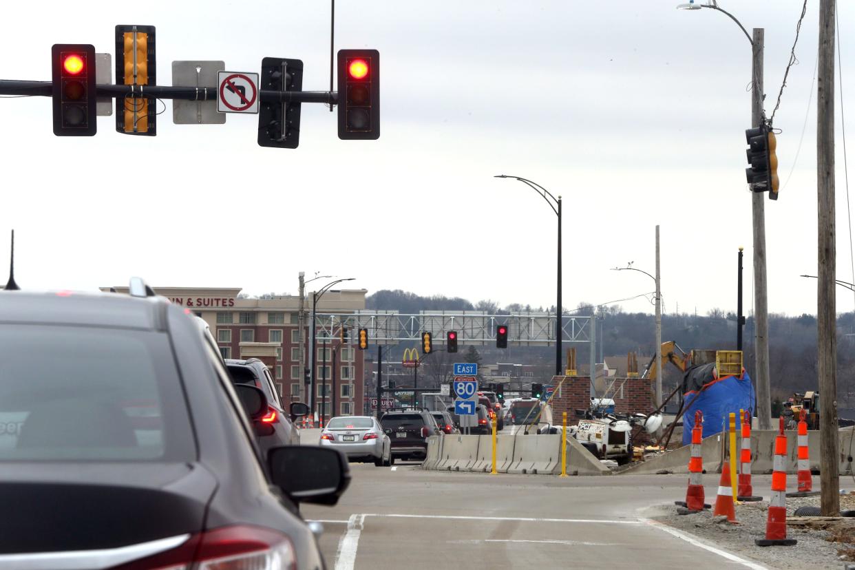 Cars travel along 1st Avenue near construction on the 1st Avenue Brdige over Interstate 80 on March 25, 2024, in Coralville, Iowa. The project will mark a major milestone on Thursday, May 23, when traffic is reconfigured to accomodate the new "diverging diamond" interchange.