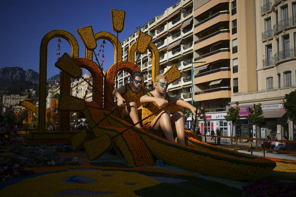 An olympic rowing sculpture made with lemons is pictured during the 90th Olympia in Menton edition of the Lemon Festival in Menton, southern France, Saturday, Feb. 17, 2024. (AP Photo/Daniel Cole)