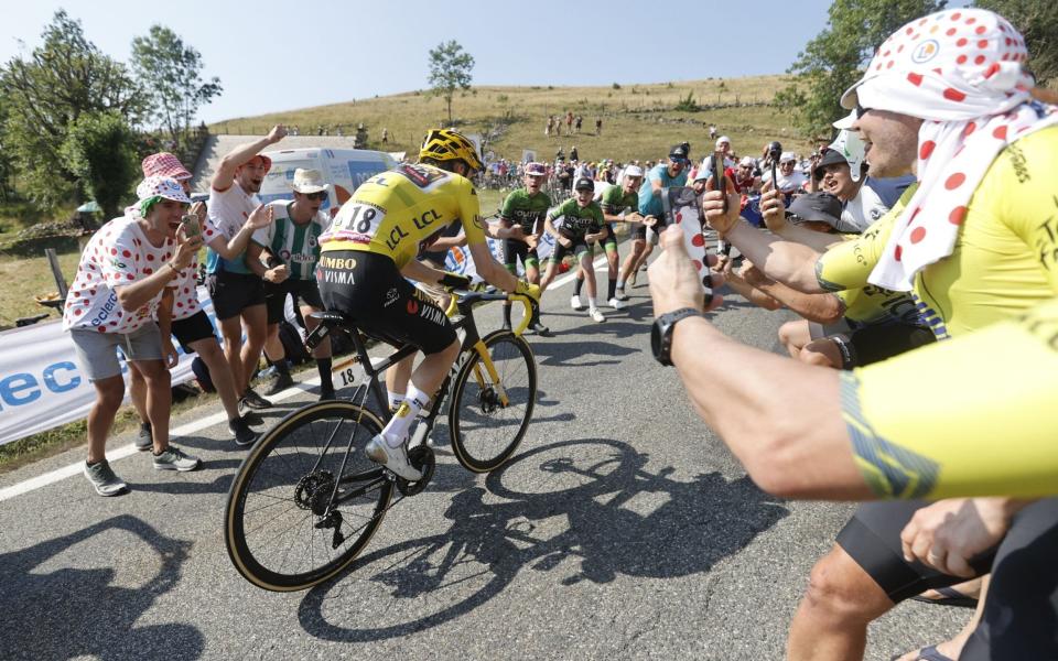 Jonas Vingegaard is cheered on by the raucous crowds on the Hautacam - EPA