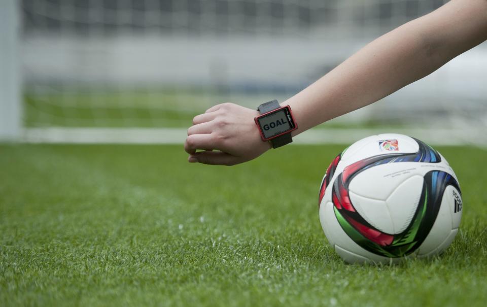 A Hawk-Eye staff member presents a wristwatch used as a part of the Hawk-Eye goal-line technology, which will be used for the first time in Germany during the Saturday&#39;s German Cup final (DFB Pokal) at the Olympic stadium in Berlin, May 26, 2015.  REUTERS/Stefanie Loos