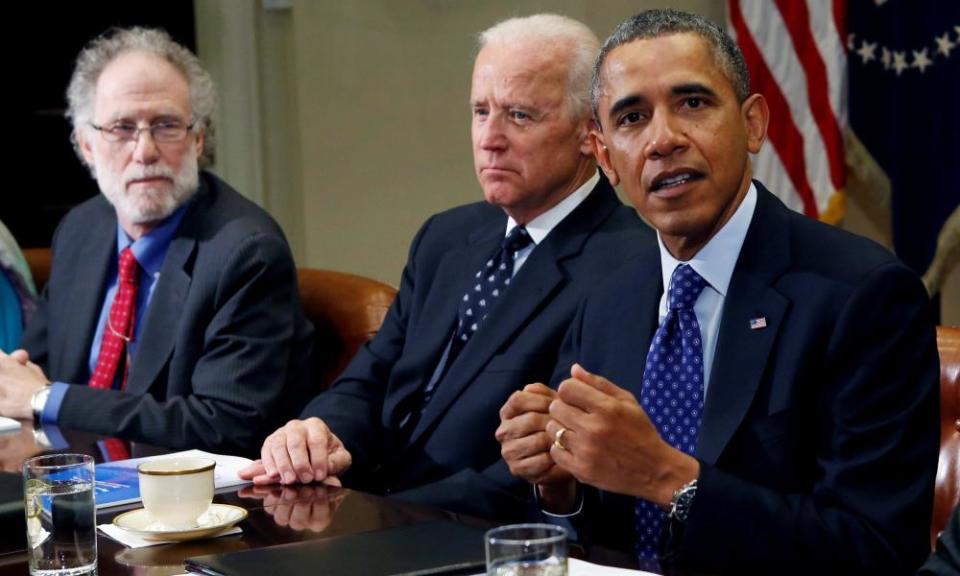 Bob Bauer and then Vice-President Joe Biden listen as President Barack Obama speaks during a meeting on elections law, in 2014.