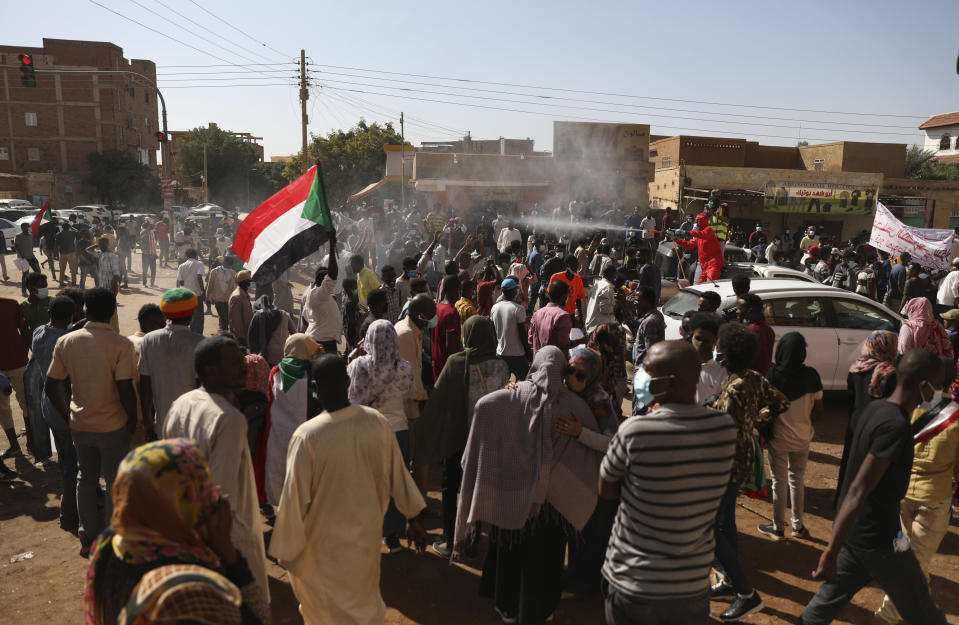 Protesters gather in Khartoum, Sudan, Saturday, Dec. 19, 2020. Protests in Sudan’s capital and across the country are demanding a faster pace to democratic reforms, in demonstrations that are marking the two-year anniversary of the uprising that led to the military’s ouster of strongman Omar al-Bashir. (AP Photo/Marwan Ali)