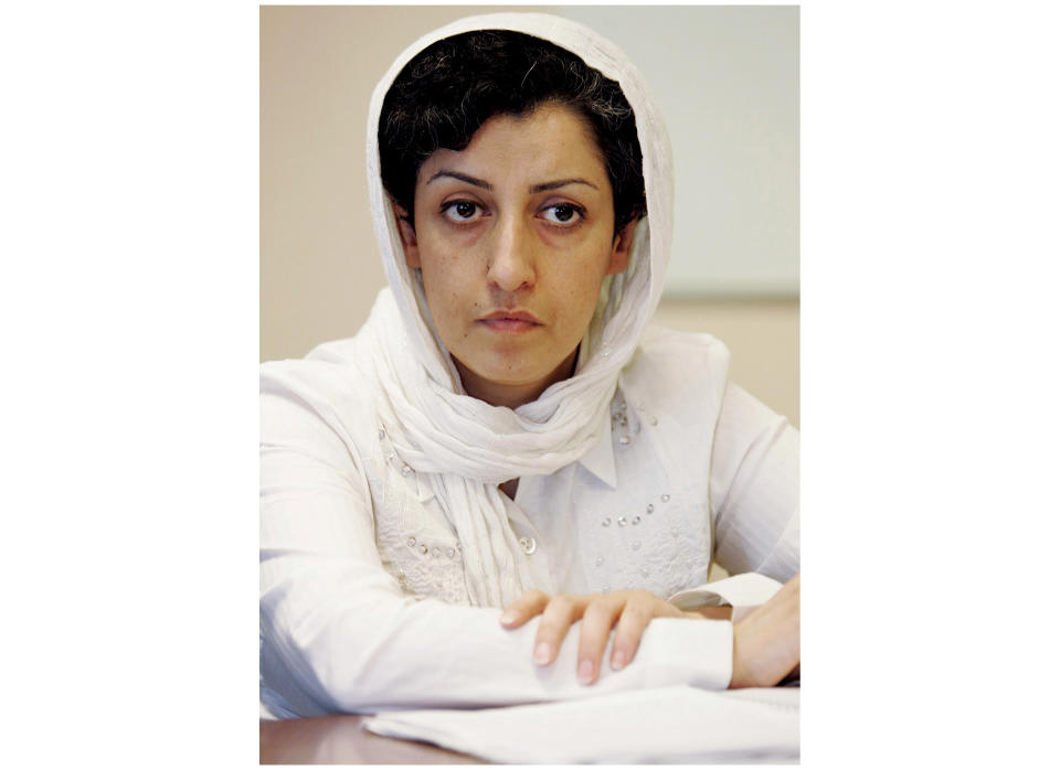 FILE - Iranian Narges Mohammadi, delegate of the Center for Human Rights Defenders, listens to a question during a press conference on the Assessment of the Human Rights Situation in Iran, at the U.N. headquarters in Geneva, Switzerland, on June 9, 2008. The Nobel Peace Prize has been awarded to Narges Mohammadi for fighting oppression of women in Iran. The chair of the Norwegian Nobel Committee announced the prize Friday, Oct. 6, 2023 in Oslo. (Magali Girardin/Keystone via AP, File)