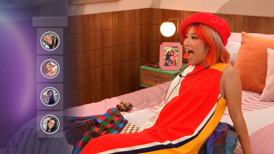 Person in bed dressed as character Judy Funnie from the cartoon 'Doug', looking surprised. Icons of other characters to the left