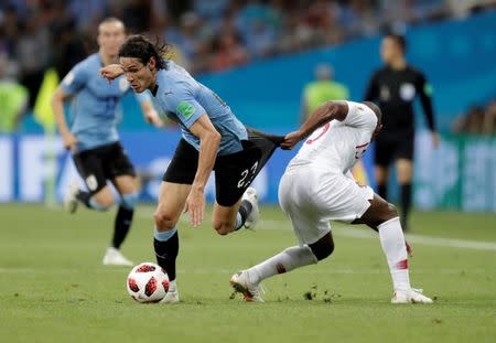 Soccer Football - World Cup - Round of 16 - Uruguay vs Portugal - Fisht Stadium, Sochi, Russia - June 30, 2018 Uruguay's Edinson Cavani in action with Portugal's Ricardo Pereira. REUTERS/Henry Romero