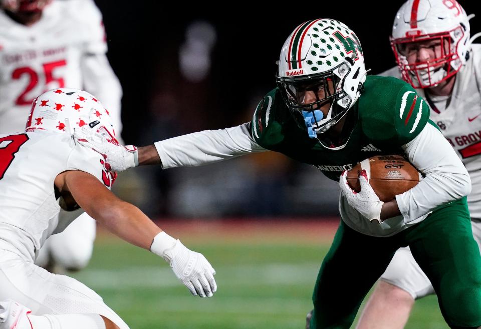 Lawrence North Wildcats wide receiver Omar Cooper (11) rushes the ball up the field Friday, Nov. 12, 2021 at Lawrence North High School, in Indianapolis. Center Grove defeated Lawrence North Wildcats, 29-19, for the IHSAA Class 6A Regional championship. 