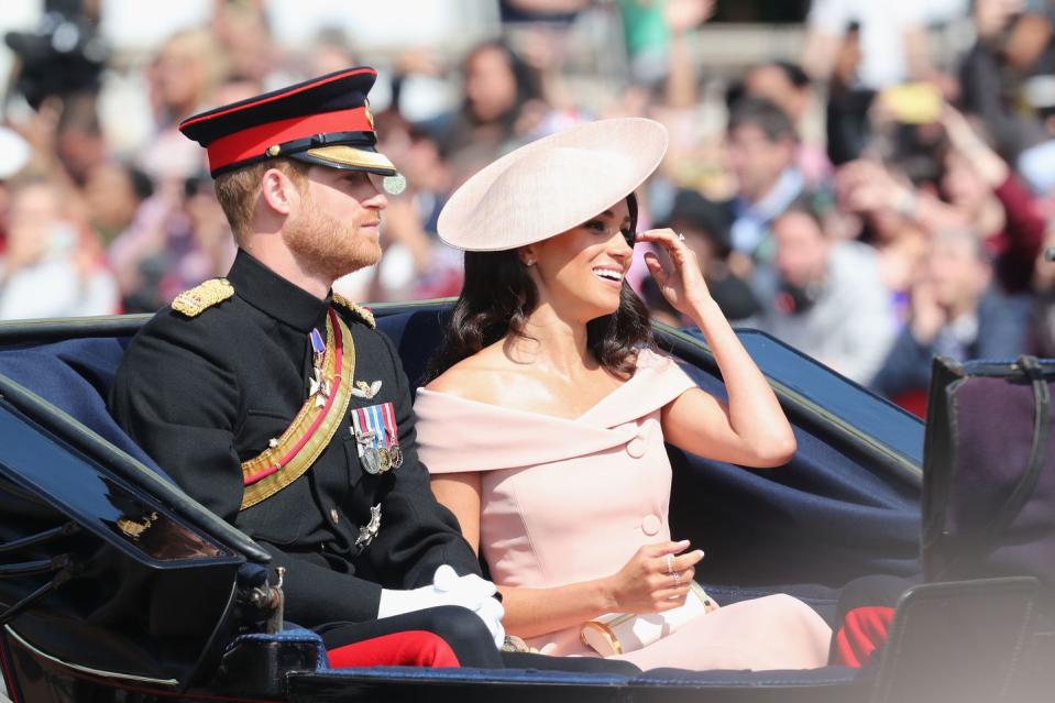 <p>The Duchess of Sussex made her first appearance alongside Prince Harry, who did not march on horseback as <a rel="nofollow noopener" href="https://www.harpersbazaar.com/celebrity/a21245625/prince-harry-not-on-horseback-trooping-the-colour-2018/" target="_blank" data-ylk="slk:he is not a royal colonel;elm:context_link;itc:0;sec:content-canvas" class="link ">he is not a royal colonel</a>.</p>