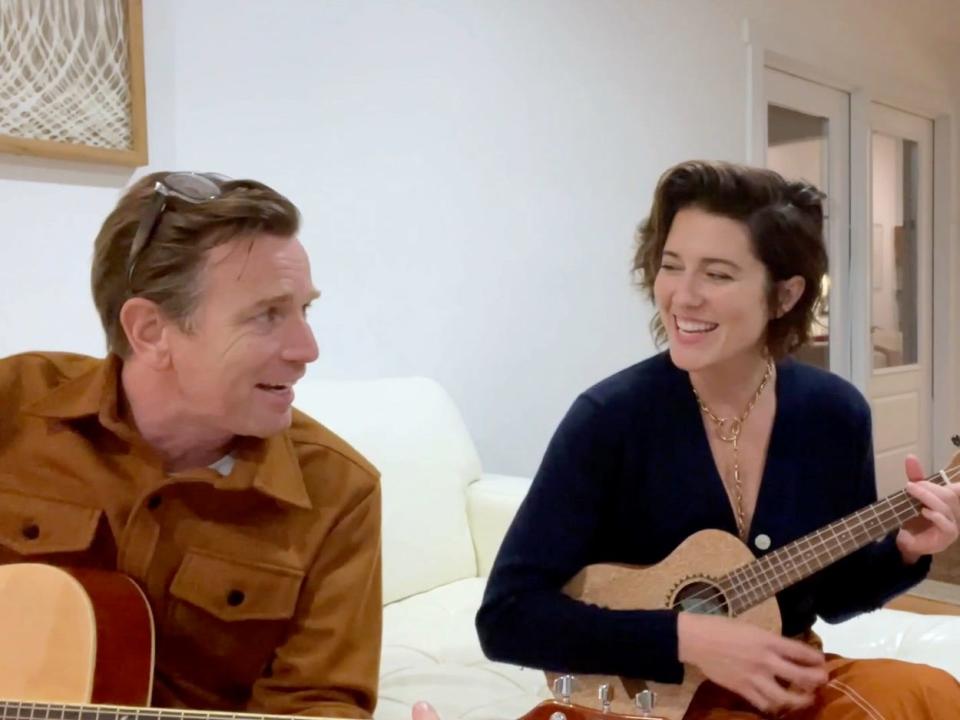 Ewan McGregor and Mary Elizabeth Winstead playing guitars and singing in October 2021.