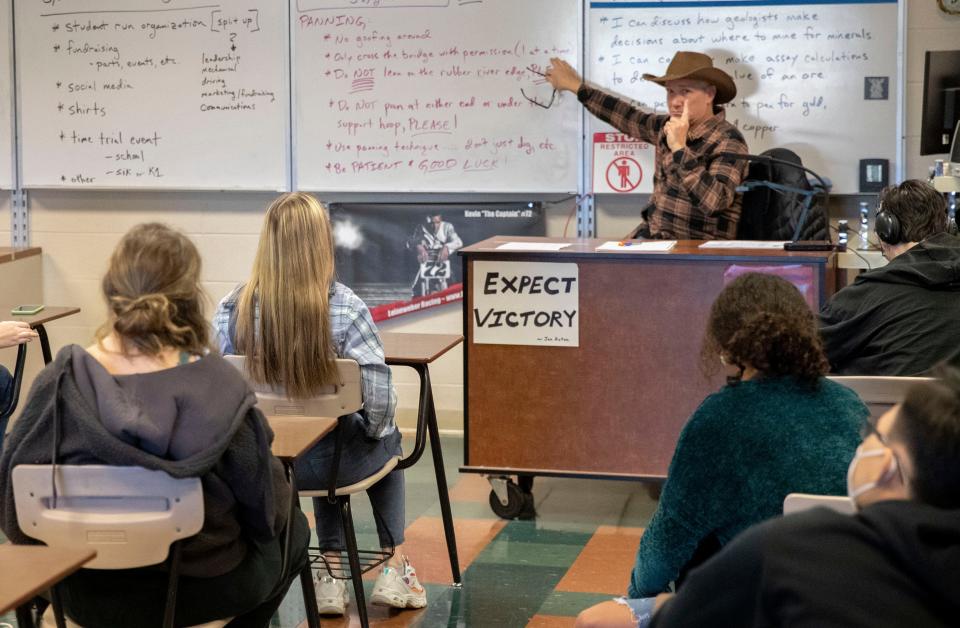 Teacher Kevin Leineweber explains the process before allowing his students to pan for gold Tuesday, Nov. 2, 2021, at Greenwood High School. Leineweber built a stream in his classroom to teach his students about the gold rush.
