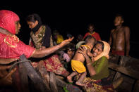 <p>Boats full of people continue to arrive along the shores of the Naf river as Rohingya refugees arrive in the safety of darkness September 27, 2017, on Shah Porir Dwip island, Cox’s Bazar, Bangladesh. (Photograph by Paula Bronstein/Getty Images) </p>