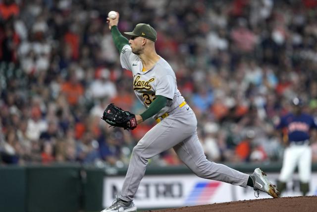 Oakland Athletics starting pitcher James Kaprielian throws against the Houston Astros during the first inning of a baseball game Sunday, May 21, 2023, in Houston. (AP Photo/David J. Phillip)