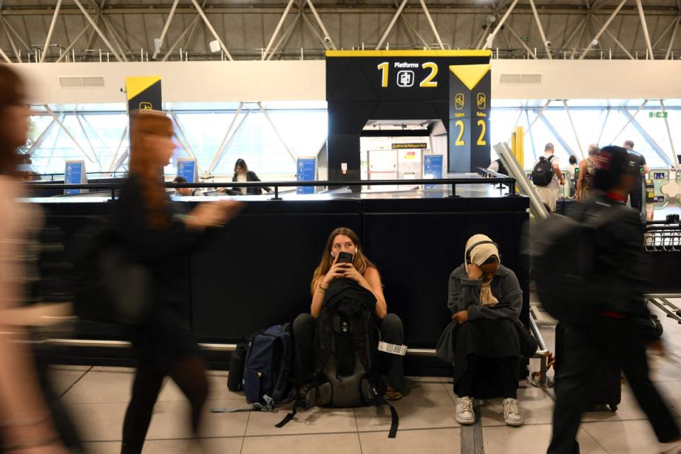It was a waiting game for many passengers at British airports (AFP via Getty Images)